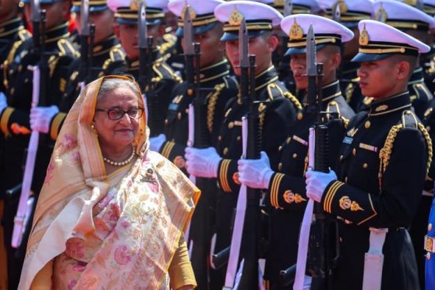 Bangladeshi Prime Minister Sheikh Hasina reviews an honour guard. 