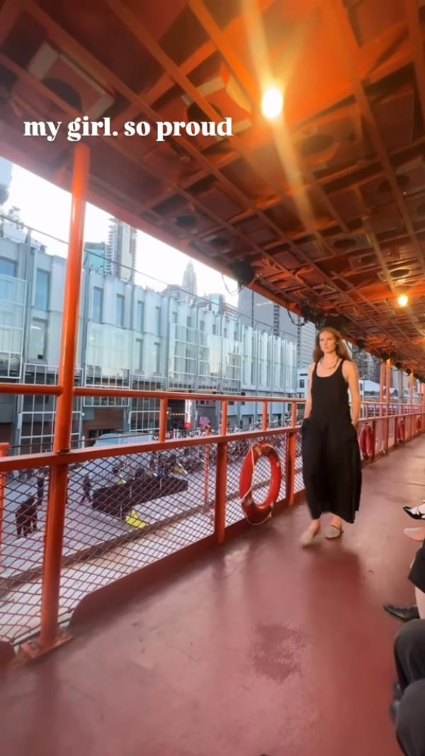 Brooke Shields, actress, model, author, and entrepreneur, walking on a bridge in a black dress