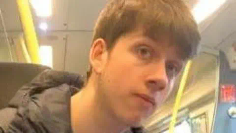 Lancashire Constabulary A picture of Thomas Dures, 21, who is wearing a black coat and has short light brown hair