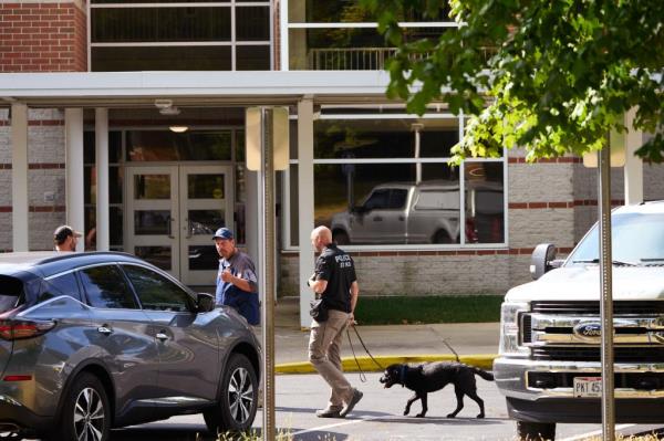 Law enforcement officers outside Perrin Woods Elementary School after it was evacuated following a bomb threat on Friday. 